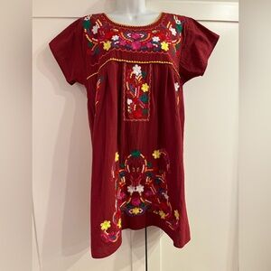 Gorgeous fiesta dress with vibrant embroidery.